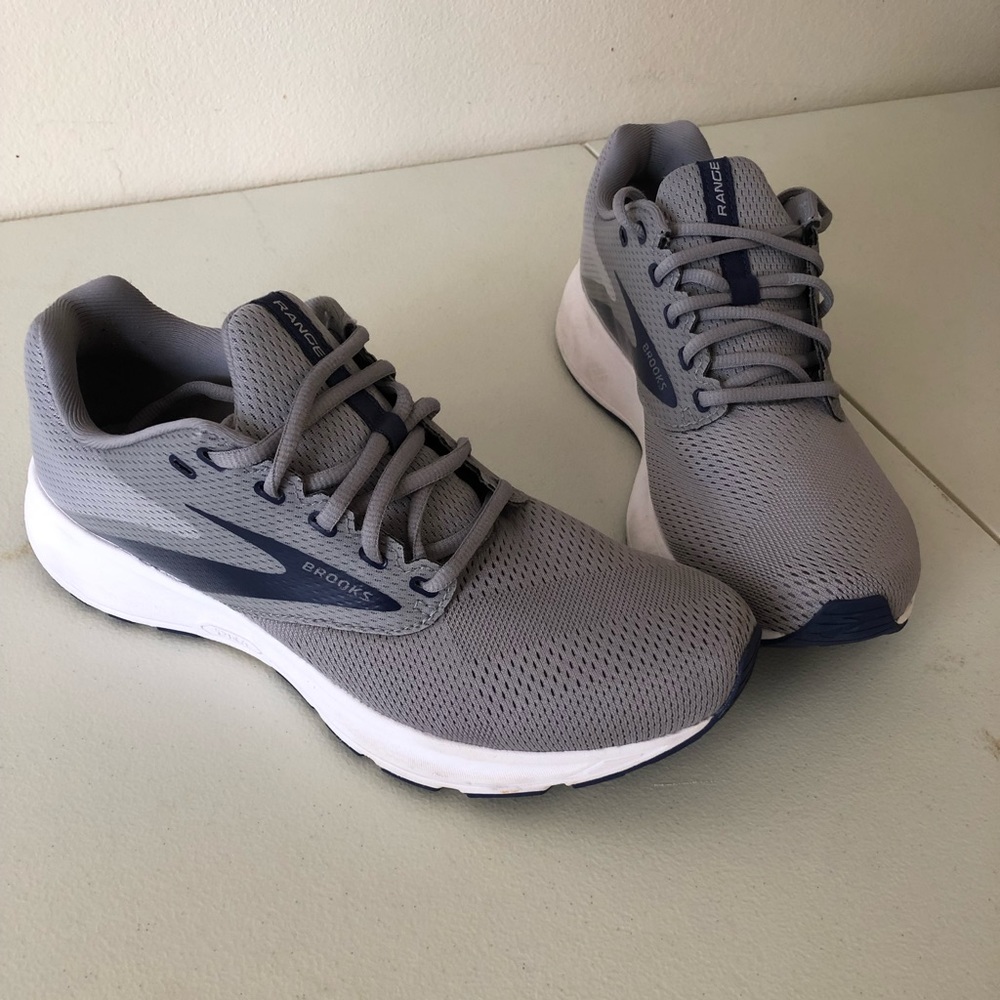 Used only once! These light weight gray sneakers are perfect for running.